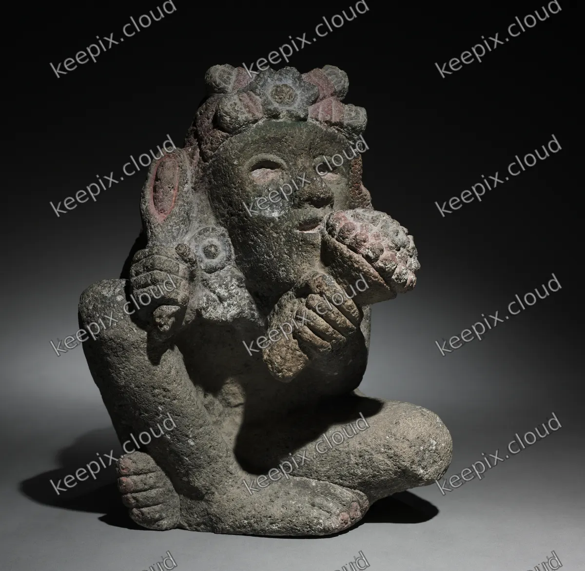 Seated Male Carrying Maize